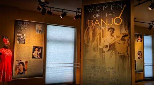 Exhibit featuring "Women of the Banjo" with text and images celebrating women's contributions to music.