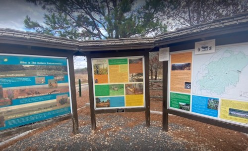 Information panels at a park, featuring maps and details about local wildlife and natural features.