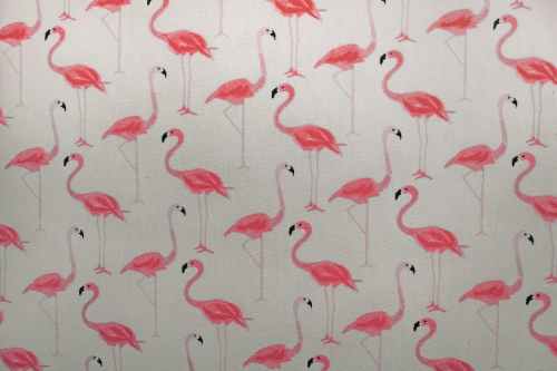 A repeating pattern of pink flamingos on a light background.