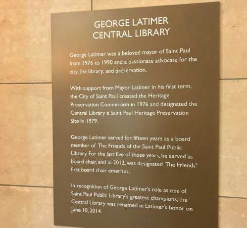 Plaque honoring George Latimer, former mayor of Saint Paul, for his contributions to the library and preservation efforts.