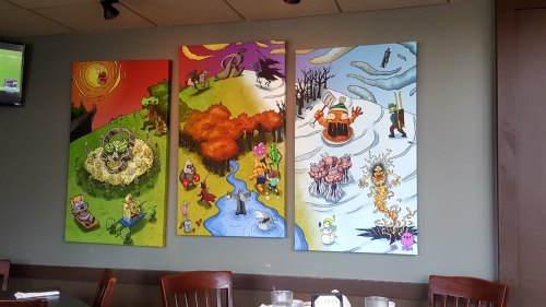 Three colorful murals depicting whimsical scenes with animals and nature, featuring various seasonal themes.