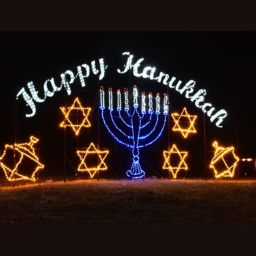 A festive display with "Happy Hanukkah" in lights, featuring a menorah and Star of David decorations.