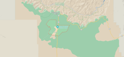 Map showing the Grand Canyon National Park area, highlighting roads and natural features in green and beige tones.