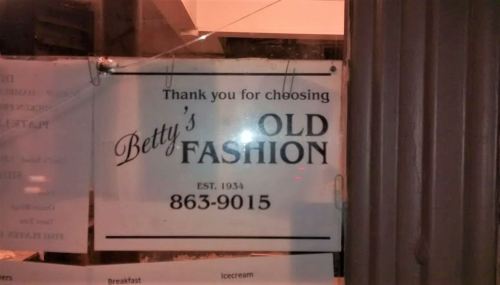 Sign for Betty's Old Fashion, thanking customers and displaying the establishment's phone number and founding year.