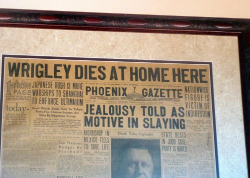Historic newspaper headline announcing "Wrigley Dies at Home Here," with details on the event and related news.