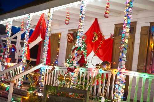 A festive porch decorated with colorful lights, red drapes, and holiday ornaments, creating a cheerful atmosphere.