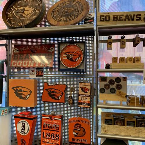 Display of Oregon State Beavers merchandise, including signs, coasters, and decorative items.