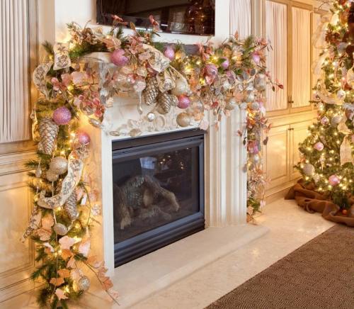A beautifully decorated fireplace with garlands, ornaments, and lights, surrounded by a festive holiday atmosphere.
