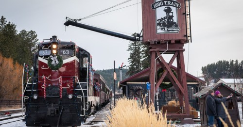 The 1880 Train locomotive decorated with wreaths and lights for the South Dakota Holiday Express.
