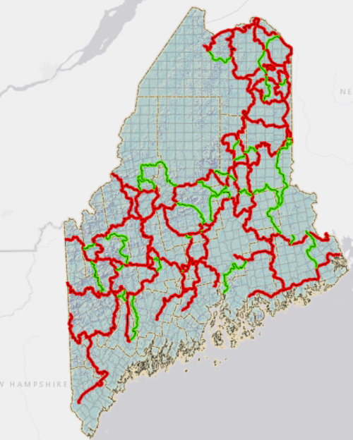 Map of Maine showing red and green lines, indicating different routes or boundaries across the state.