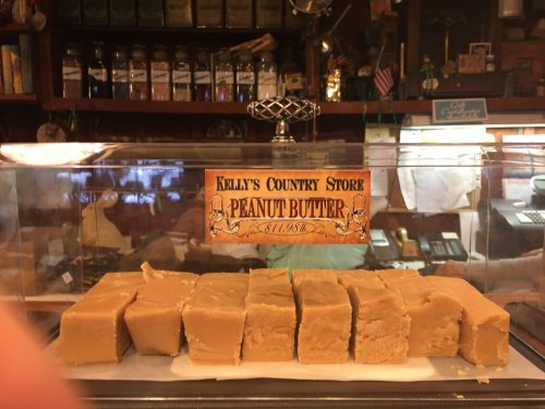 A display of peanut butter fudge blocks in a glass case at Kelly's Country Store.