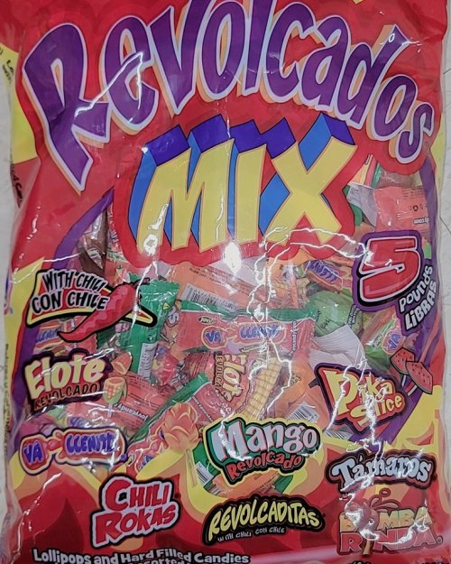 A colorful bag of assorted candies labeled "Revolcados Mix," featuring various flavors and types, including chili and fruit.