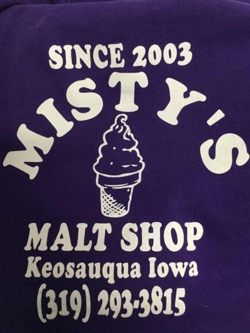 Purple shirt featuring "Misty's Malt Shop" logo with an ice cream cone, established in 2003, located in Keosauqua, Iowa.