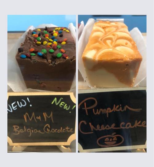 Two types of fudge: one with M&M's and Belgian chocolate, the other with pumpkin cheesecake, displayed with labels.