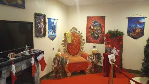 A festive room with a decorated chair, stockings, holiday decorations, and a red carpet, creating a cozy holiday atmosphere.