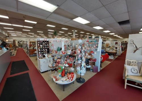 A spacious store filled with various decorative items, including holiday decorations and vintage collectibles.