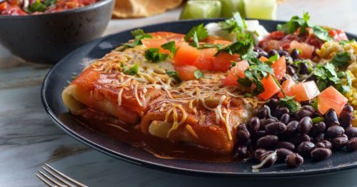 Close up of a plate of chimichangas, black beans, and pico de gallo at a Mexican restaurant in Arizona