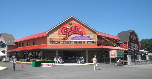 A large general store with a colorful sign reading "World's Largest General Store" and a festive atmosphere.