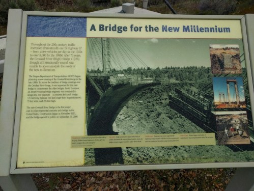 Sign about the "Bridge for the New Millennium," detailing its history and construction in the 20th century.
