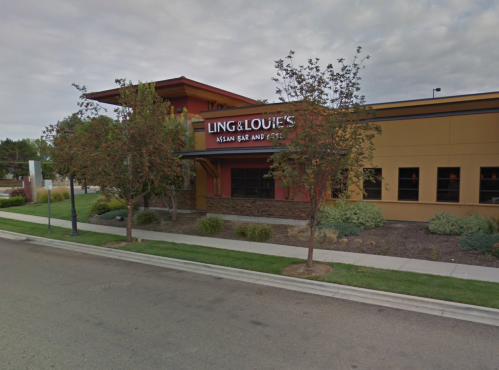 Exterior of Ling & Louie's Asian Bar and Grill, featuring a modern design and landscaping along a quiet street.