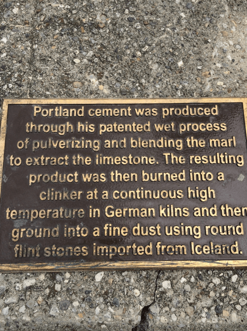 A plaque detailing the process of producing Portland cement from limestone and flint stones imported from Iceland.