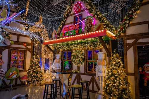 A festive holiday scene featuring a decorated cabin with lights, ornaments, and nutcracker figures.