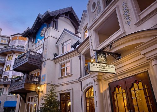 Exterior view of The Arabell at Vail Square, featuring charming architecture and a festive atmosphere.