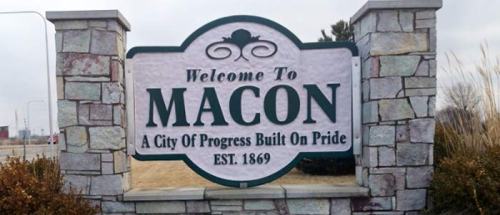 Welcome sign for Macon, stating "A City of Progress Built on Pride" and established in 1869.