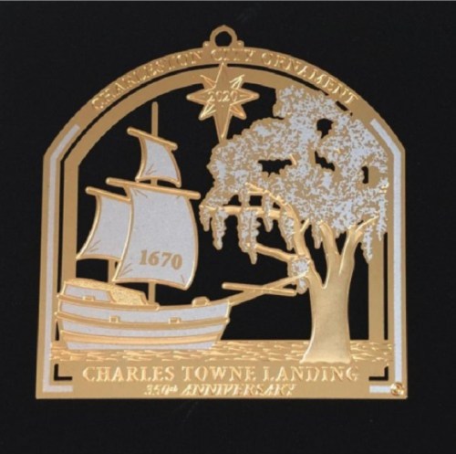 Gold ornament featuring a ship and tree, commemorating the 325th anniversary of Charles Towne Landing, established in 1670.