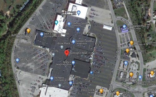 Aerial view of Huntington Mall, showing parking lots and nearby businesses like Macy's and Buffalo Wild Wings.