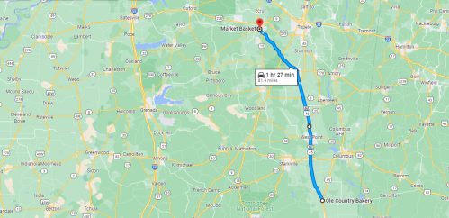 Map showing a route from Market Basket to Oole Country Bakery, with a travel time of 1 hour and 27 minutes.