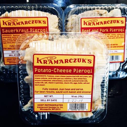 Three packages of Kramarczuk's pierogi: sauerkraut, beef and pork, and potato-cheese, all fully cooked and ready to heat.