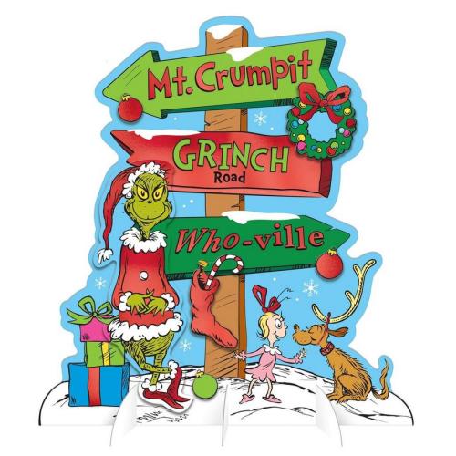 A colorful signpost with directions to Mt. Crumpit, Grinch Road, and Who-ville, featuring the Grinch, a girl, and a reindeer.