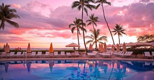 A serene poolside scene at sunset, with palm trees, lounge chairs, and vibrant pink and purple skies.