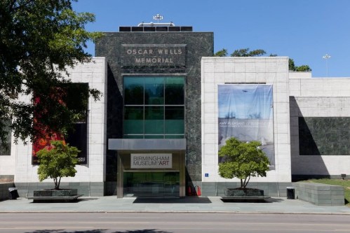 Exterior view of the Birmingham Museum of Art, featuring the Oscar Wells Memorial entrance and large banners.