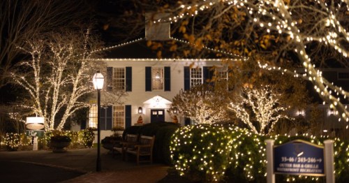 exterior of wequassett resort and spa decked ou in christmas lights ta night in harwich massachusetts