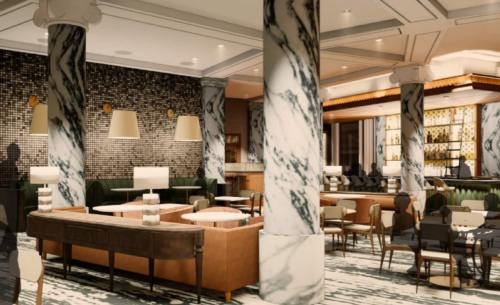 Elegant restaurant interior featuring marble columns, stylish seating, and a well-lit bar area.