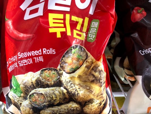 A red package of crispy seaweed rolls featuring images of the product and Korean text.