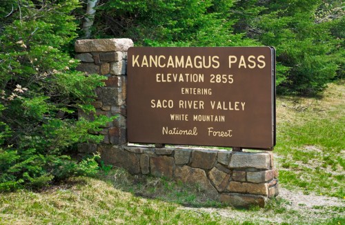 Sign for Kancamagus Pass, elevation 2855, entering Saco River Valley, White Mountain National Forest.