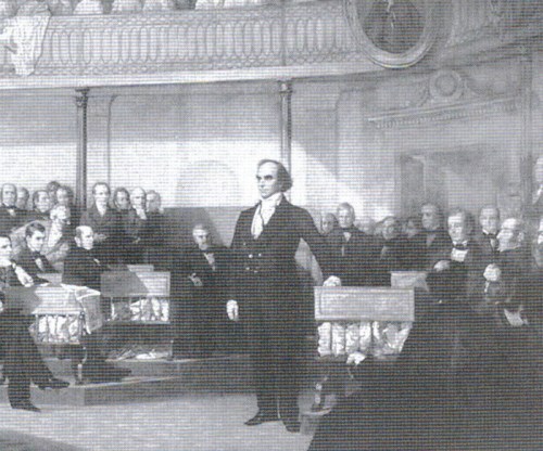 A historical scene depicting a man speaking in a legislative assembly, surrounded by seated officials and onlookers.