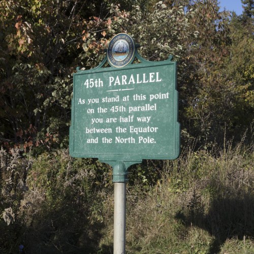 Sign marking the 45th parallel, indicating it's halfway between the Equator and the North Pole.
