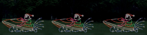 A festive light display featuring a character in a Santa hat riding a jet ski, surrounded by colorful water splashes.