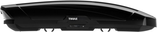 A sleek black roof box with a streamlined design, featuring the Thule logo prominently displayed.