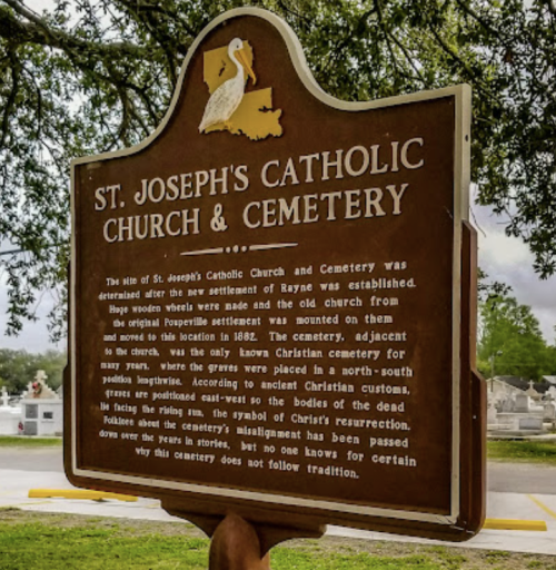 Sign for St. Joseph's Catholic Church & Cemetery, detailing its history and significance in Rayne, Louisiana.