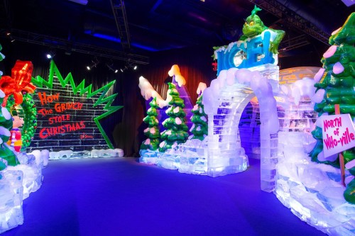 Colorful ice sculptures depicting scenes from "How the Grinch Stole Christmas," with festive decorations and trees.