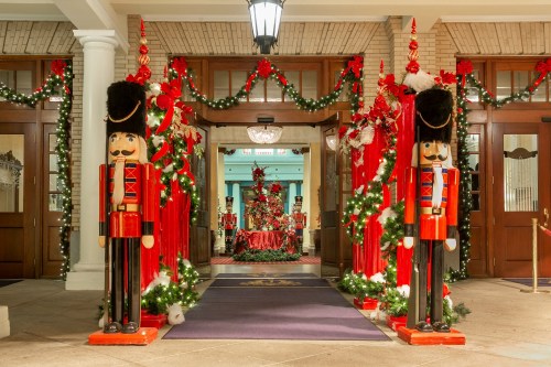 Entrance decorated for the holidays, featuring nutcracker figures, red garlands, and festive lights.