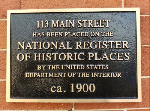 Plaque at 113 Main Street indicating it is on the National Register of Historic Places, dated circa 1900.