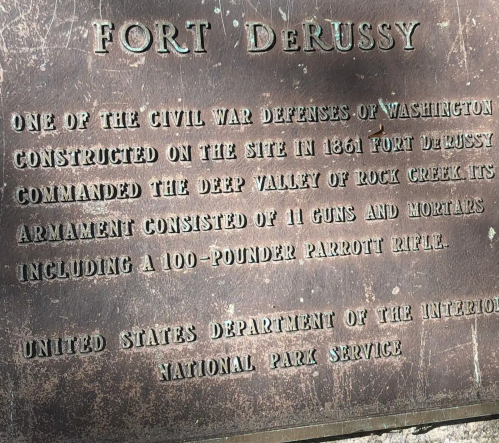 Plaque detailing Fort DeRussy, a Civil War defense in Washington, highlighting its history and armament.