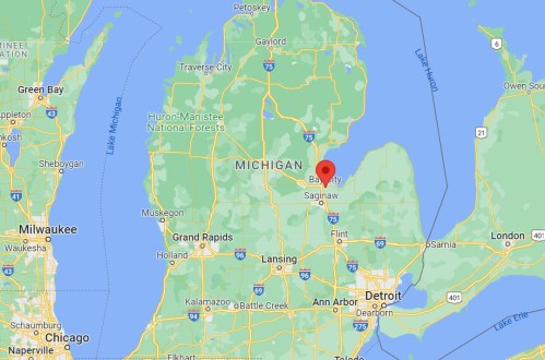 Map of Michigan highlighting the Bay City area, near Saginaw, with surrounding cities and waterways.