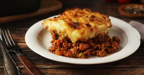Close up of a piece of Shepherd's pie from an Irish restaurant in Maryland on a wooden table